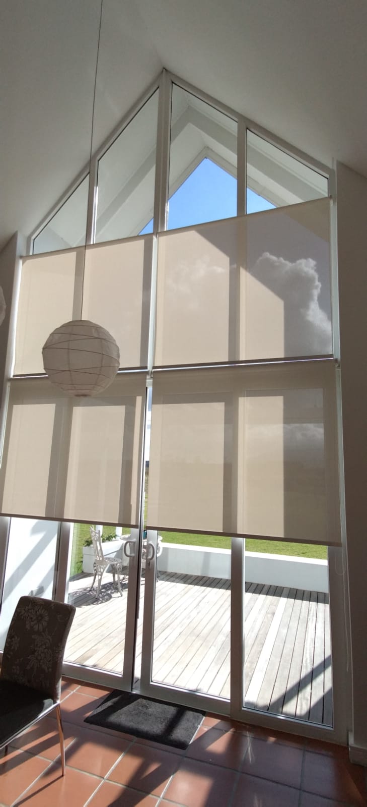 Pitched ceiling cream roller blinds