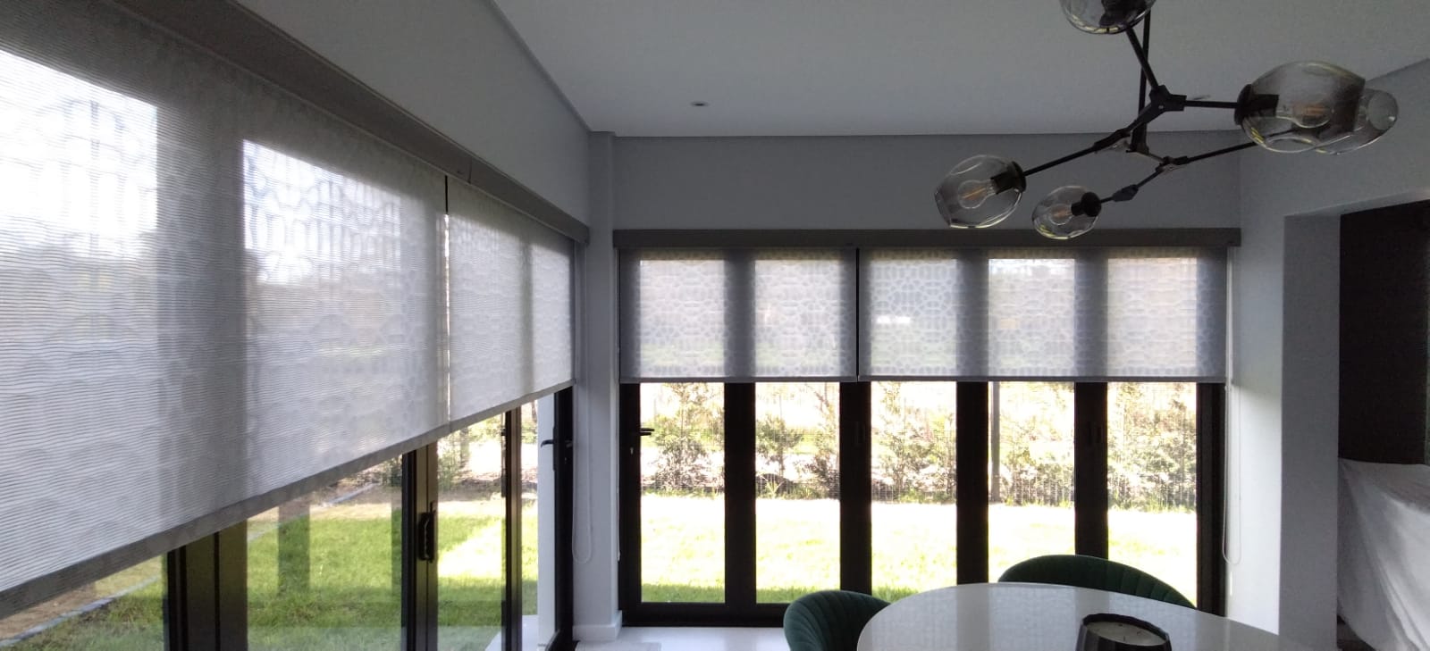 Sheer roller blinds dining room sputnik chandelier
