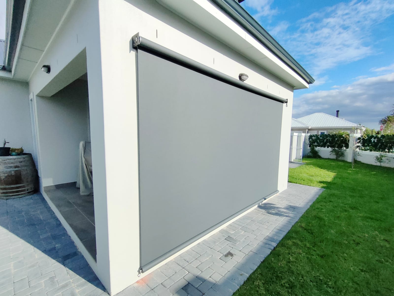 Charcoal exterior roller blind blue sky